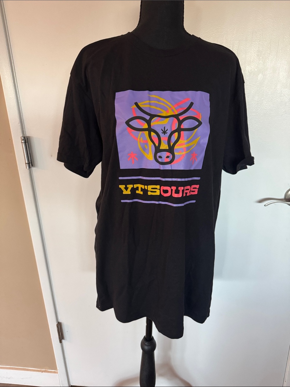 Black Graphic Tee with Colorful Cow Motif